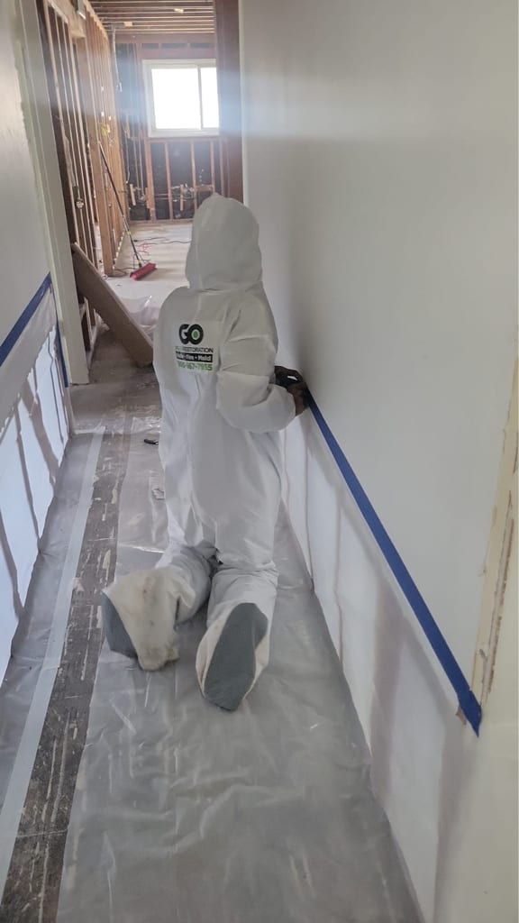 Go Green technician performing water damage repair